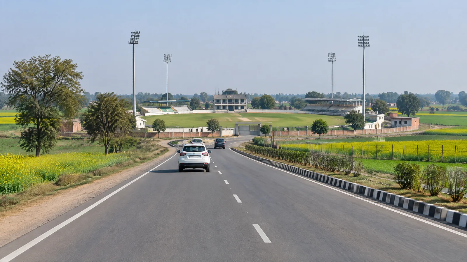 Road approach to CH Bansi Lal Cricket Stadium in Lahli