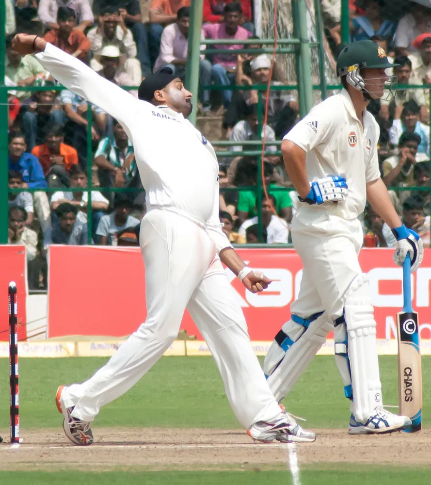 Harbhajan Singh bowling in a 2010 Test; archival spin-bowling imagery